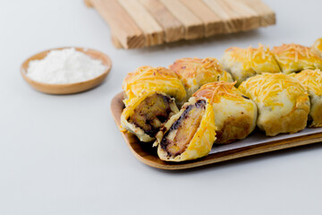 Banana Bolen or Banana Wrap with Puff Pastry. Usually given cheese topping.