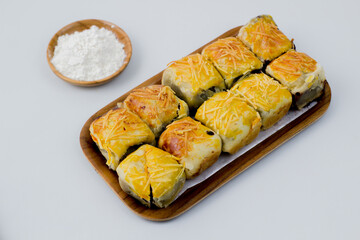 Banana Bolen or Banana Wrap with Puff Pastry. Usually given cheese topping.