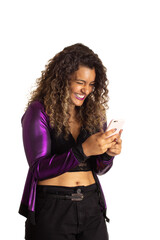 Woman with curly hair is checking smart cell phone and giggling. Isolated on white background.