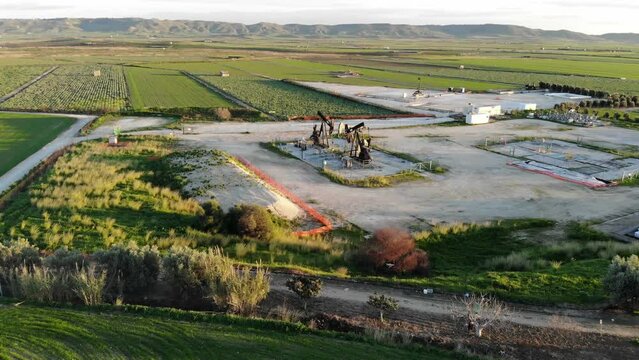 Oil pump oil rig energy industrial machine for petroleum in the countryside - Oil well, pump jack - Oil industry background - pumpjack working - Oil rig energy industrial machine for petroleum