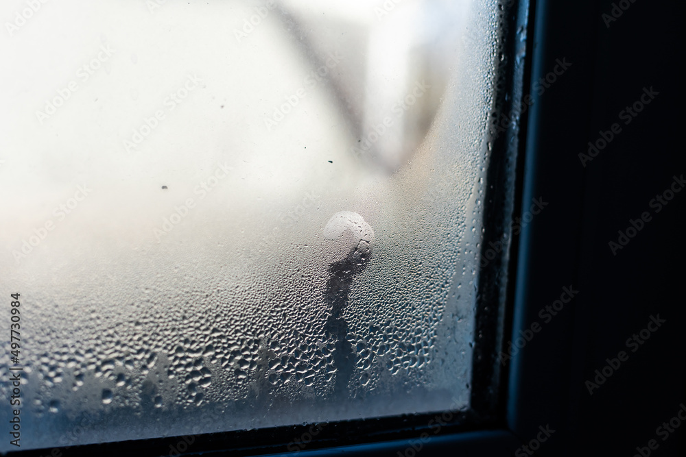 Wall mural Wet window after autumn or winter rain