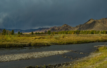 Russia. South of Western Siberia, the Altai Mountains. The first snow storm in the valley of the...