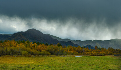 Russia. South of Western Siberia, the Altai Mountains. The first snow storm in the valley of the...