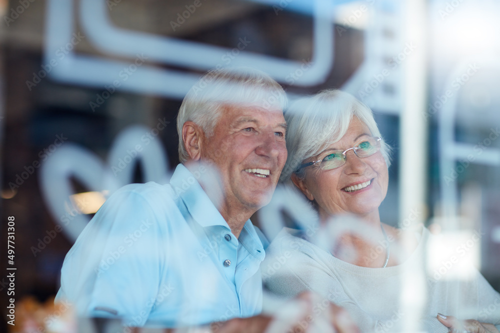 Sticker Never stop dating. Cropped shot of an affectionate senior couple in their local coffee shop.