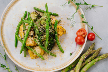 Vegetaria dish of boiled broccoli, asparagus and parmesan