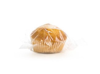 Muffins in plastic packaging. Closeup. On a white background