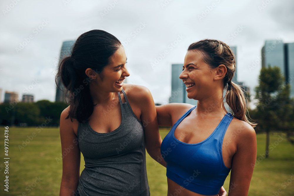 Sticker We love getting fit together. Cropped shot of two attractive young sportswomen working out together outdoors in the city.