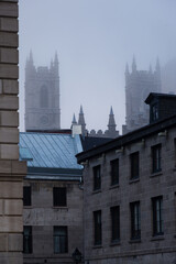 Vertical view of patrimonial buildings in the old town, with the 1829 Notre-Dame Basilica bell...