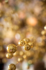 golden glitter decoration balls with blur background 