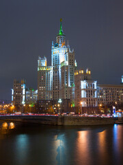Obraz premium Evening picture of high building on river bank. Moscow, Russia