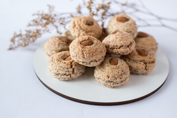Almendrados, dumplings or typical biscuits made from almonds, sugar and egg whites. Almond cakes on white background.