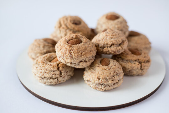 Almendrados, dumplings or typical biscuits made from almonds, sugar and eggwhite. Almond cakes on white background.