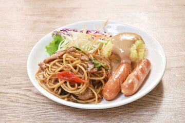 fried spicy spaghetti bacon with pork sausage and mashed potato dressing gravy sauce couple salad on plate
