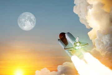 Spaceship lift off. Space shuttle with smoke and blast takes off into space on a background of a sunset with a full moon in the sky. Elements of this image furnished by NASA.