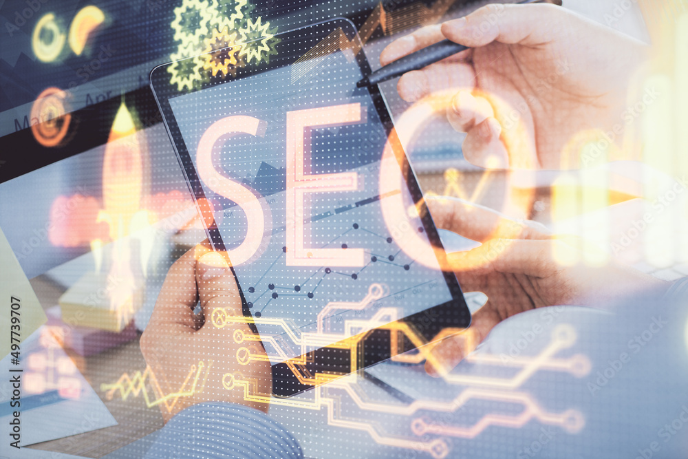 Poster Multi exposure of man's hands holding and using a digital device and seo drawing. search optimization concept.