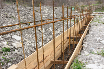 Reinforcement of the strip foundation with metal reinforcement, the top row of reinforcement is in...