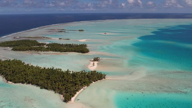 Beautiful Aerial drone shot of the lagoon, reef and ocean of  the atoll of Fakarava, French Polynesia, south pacific. Camera flies backwards