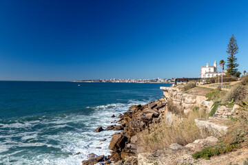 Fototapeta na wymiar Cliff coastline of the Atlantic ocean shore in Cascais near to Lisbon, Portugal, Europe