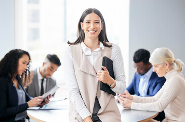 Leading my team to greatness. Shot of a young businesswoman in a meeting with her colleagues.