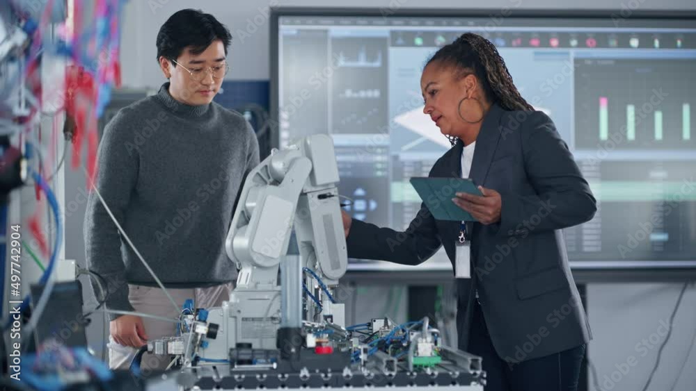 Poster Diverse Team of Student and Teacher with Tablet Analyse and Discuss How a Futuristic Robotic Arm Works and Moves During the Lesson. High Tech Research Laboratory with Modern Equipment. Medium Shot