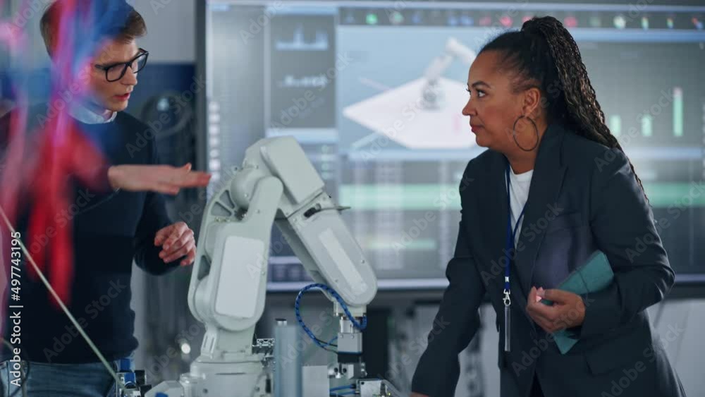 Poster male student in glasses having conversation with his black teacher while bionic claw is moving under