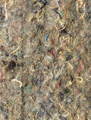 surface with pressed fabric remnants as insulating material