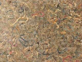 surface with pressed fabric remnants as insulating material