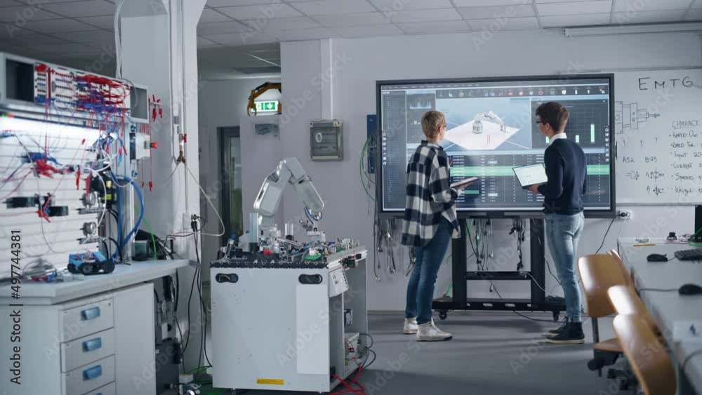 Poster two male and female students standing near big screen and discussing program for motion of robotic a