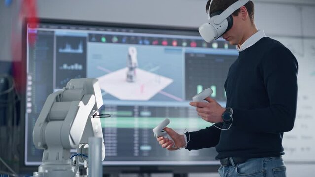 Mechanical Engineer Student Wearing Virtual Reality Headset and Holding Controllers, Uses VR technology for Industrial Design, Development, Prototyping in Robotics. High Tech Concept