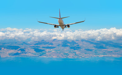 Fototapeta na wymiar Airplane landing to airport runway Blue sea and dense clouds in the background