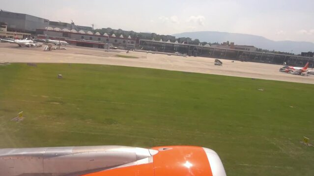 Plane Taking Off from Geneva Airport seen From the Inside of the Plane