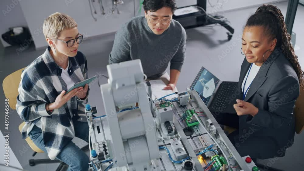 Poster Diverse Students and Black Teacher Looking at Robot Hand and Discussing It while Developing Programs at University. Education and Innovative Technologies Concept. High Angle View