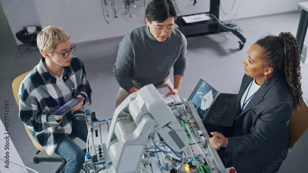 Poster black teacher with laptop and two diverse students analyse and discuss futuristic robotic arm during
