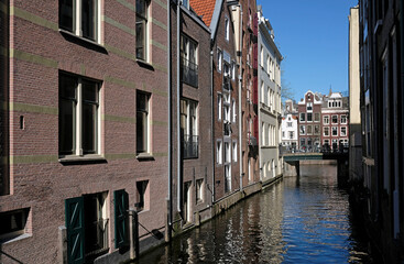 Fototapeta na wymiar Buildings along a canal in Amsterdam