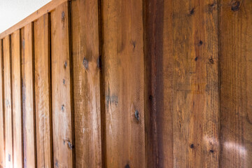 The underside of stained heart pine used as an accent wall in a 1970's mid century modern house