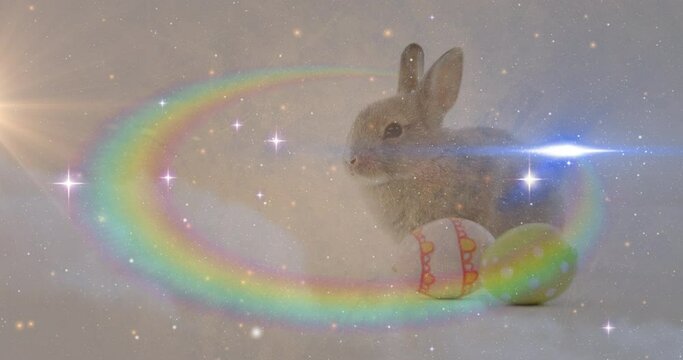 Composite video of space against easter bunny and decorative easter eggs in background