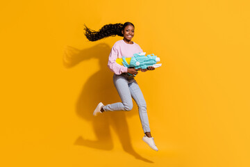 Fototapeta na wymiar Full size photo of excited crazy person hold water pistol enjoy free time isolated on yellow color background