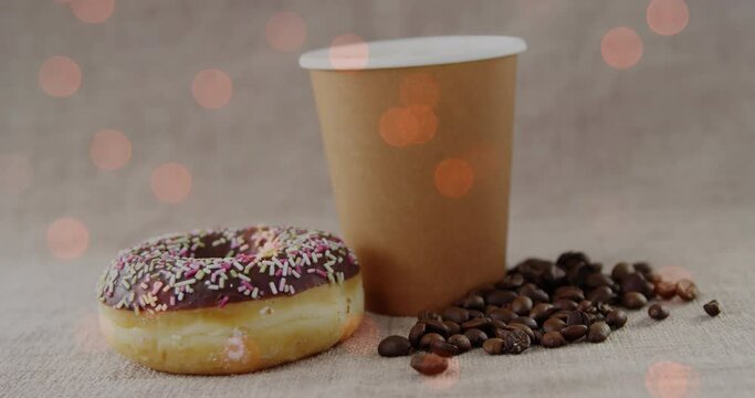Animation of coffee and donut over light spots