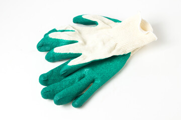 Rubberized fabric gloves on a white background. Gloves for working in the garden.