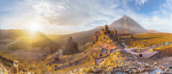 Landscape with Roques de Garcia stone and Teide mountain volcano at sunset in the Teide National...