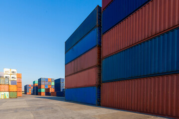 Stack of containers in a harbor. Shipping containers stacked on cargo ship. Background of Stack of Containers at a Port.