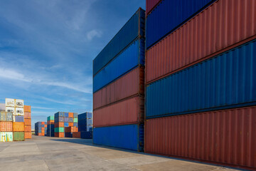 Stack of containers in a harbor. Shipping containers stacked on cargo ship. Background of Stack of Containers at a Port.