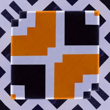 bold black and white striped geometric design with vivid orange motif