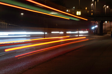 Fototapeta na wymiar Long exposure photo of traffic driving in evening
