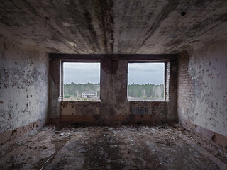 Fototapeta na wymiar Windows without glass in a dark abandoned room
