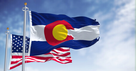 The Colorado state flag waving along with the national flag of the United States of America © rarrarorro