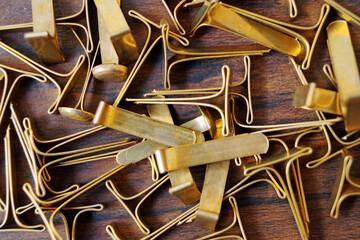brass fastener background on wood