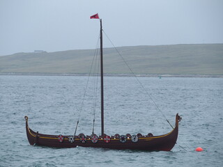 Replica of a Viking ship in Bressay Sound off the coast of Lerwick, Shetland Islands, Scotland, UK