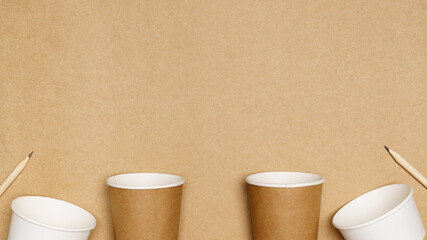 Eco friendly concept, Consist of paper cup and pencil with cotton buds on wooden background