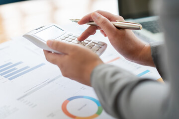 Business analyst concept the accountant calculating to estimate the amount of company’s expense
